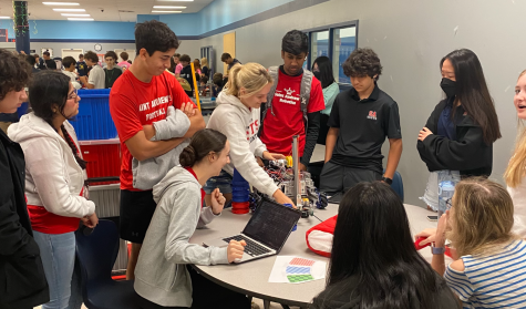 Team #17156 make their final code and design edits before competition.